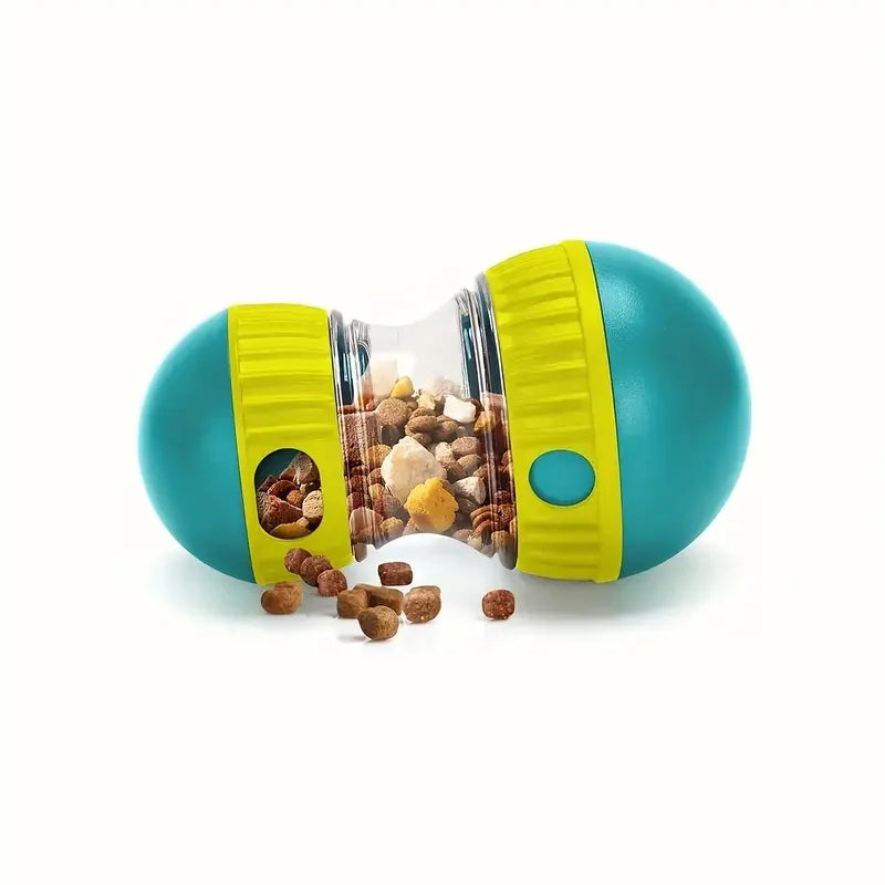 Blue and yellow wobble treat dispenser lying on its side with kibble